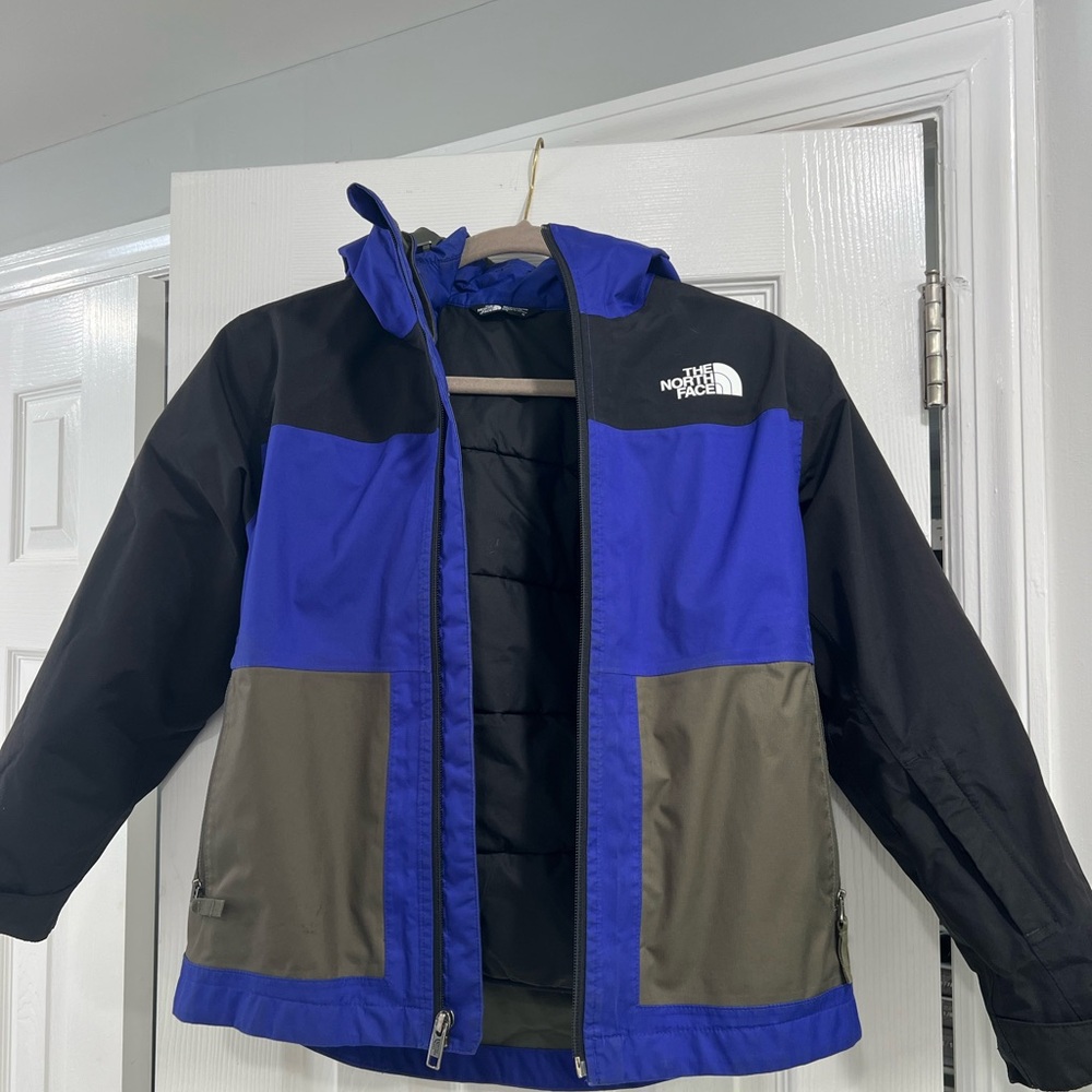 The North Face Blue and Black Raincoat with Color-Block Design